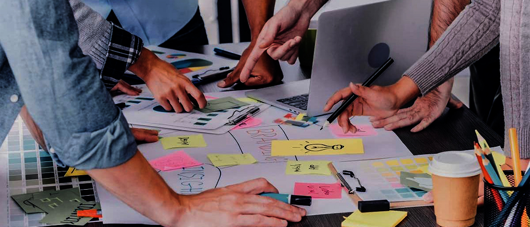 Psychologically safe team of professionals collaborating in an office to foster creativity and innovation.