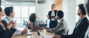 Office team assessing identified psychosocial risks to improve workplace psychological safety and wellbeing.