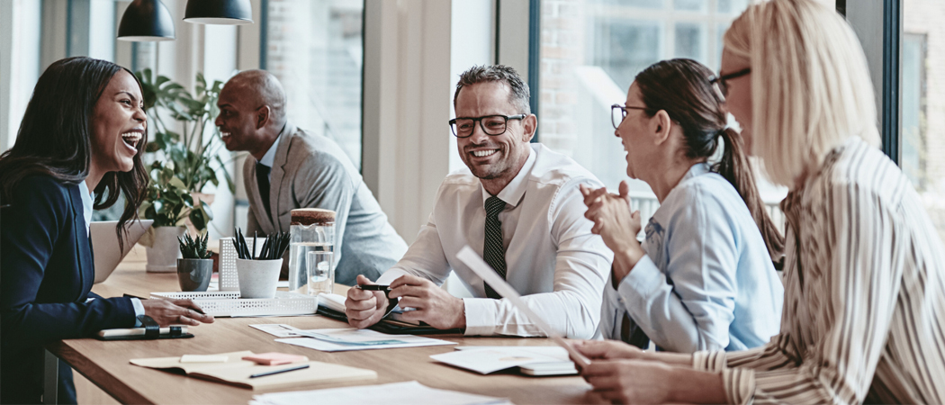 Office team collaborating to implement psychosocial risk controls and strengthen workplace psychological safety.