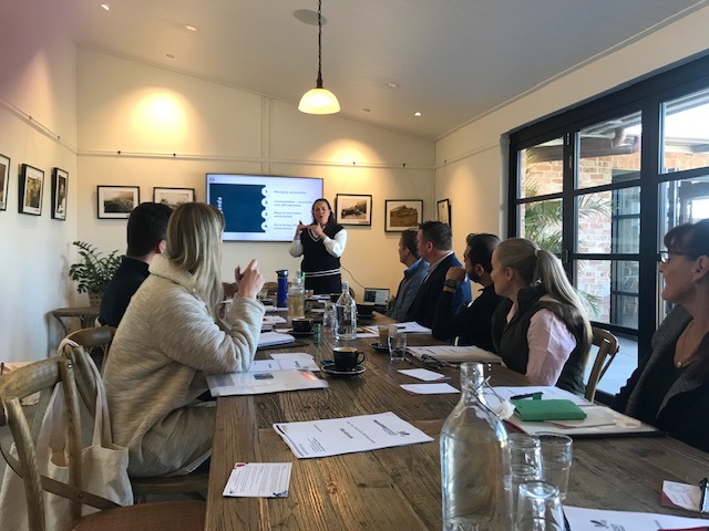 Emily Johnson, Principal Workplace Psychologist at Get Mentally Fit, delivering a workplace training session to a leadership team on Mastering Habit Formation.