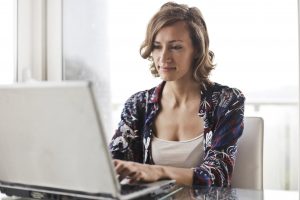 Woman using Get Mentally Fit’s online portal to access a virtual Employee Assistance Program (EAP) session.